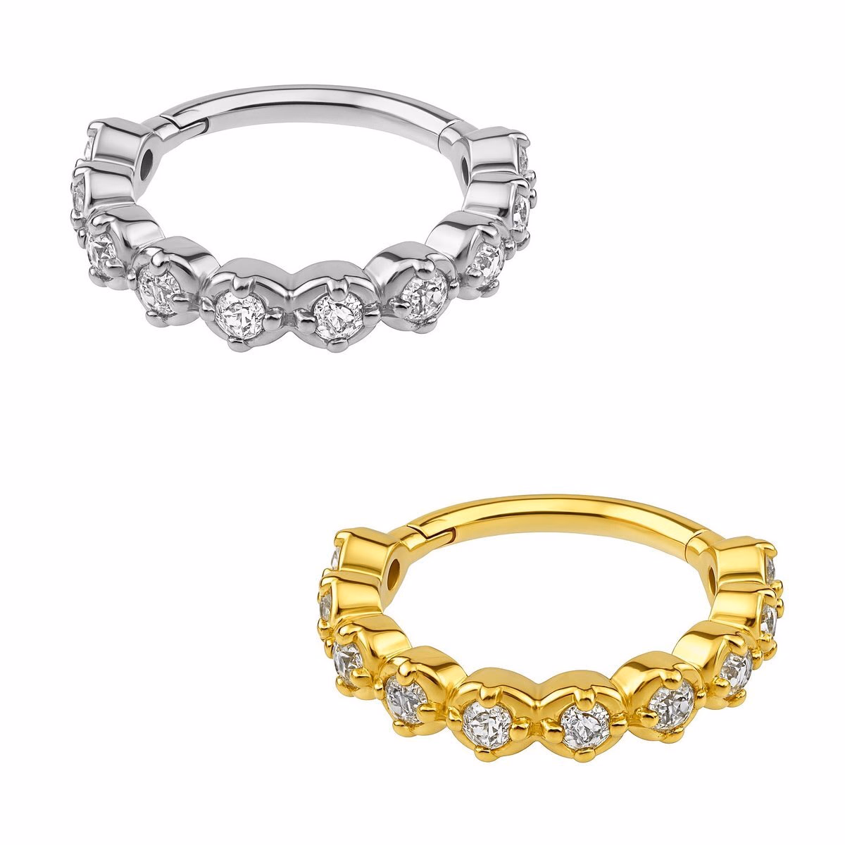 Argola clicker em aço 316L com zircônias presas por garras, nas versões prateada e dourada